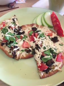 A flatbread with vegan cheese at Cup